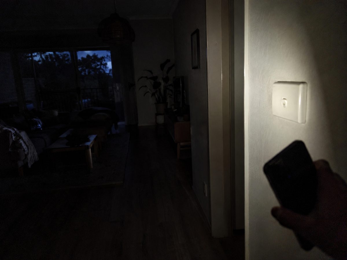 Hallway lit by a phone torch during a power outage